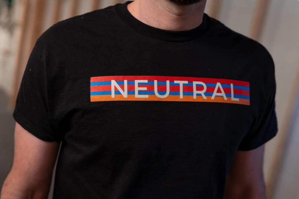 Close-up of Neutral Electricians branded shirt
